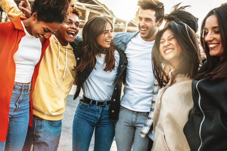 Happy multiracial young people celebrating party together outside/iStock