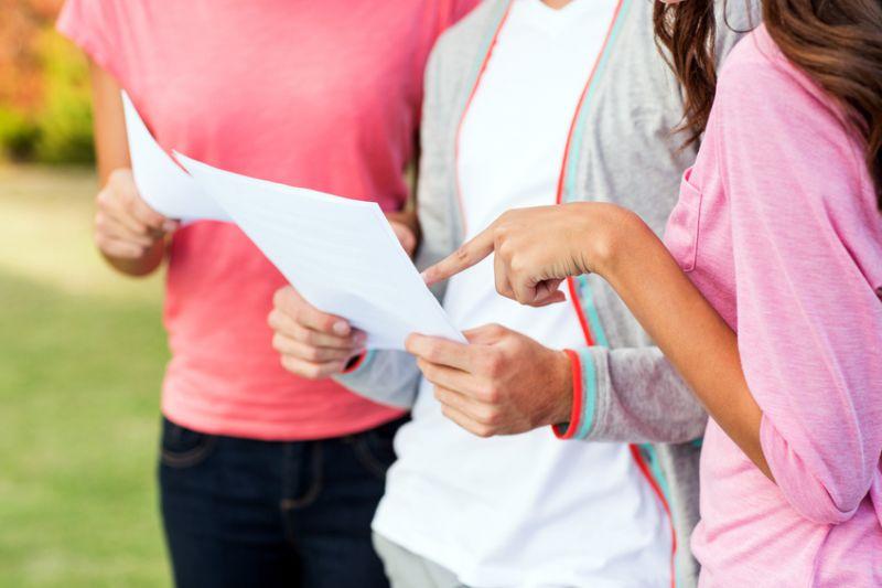 students looking at exam results