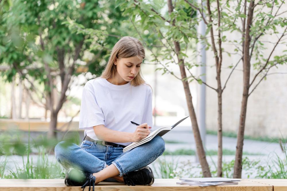 Student writing notes