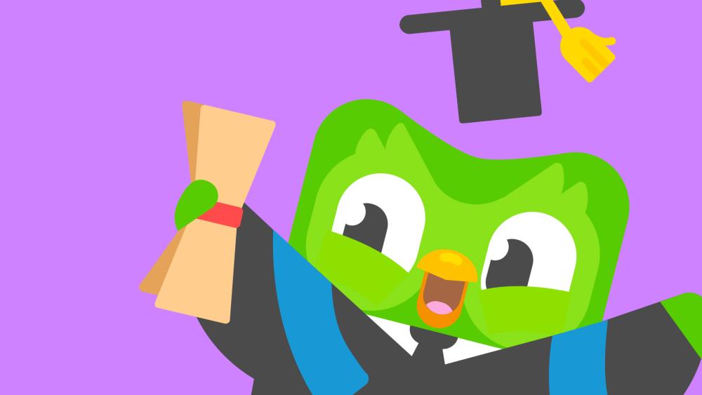 Duolingo owl wearing graduation gown with degree certificate