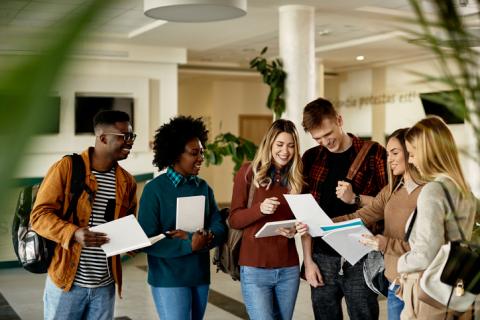 A group of students looking at their exam results - Clearing 2021