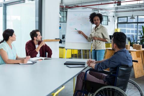 co-workers discussing ideas in an office