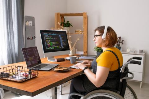 Woman in wheelchair coding