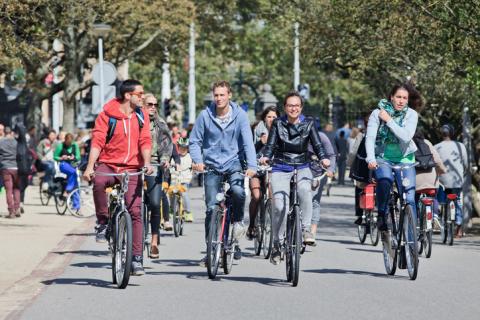 Group of cyclists have fun in the Vondelpark, Amsterdam