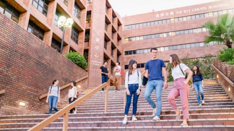 PolyU students walking downstairs on campus