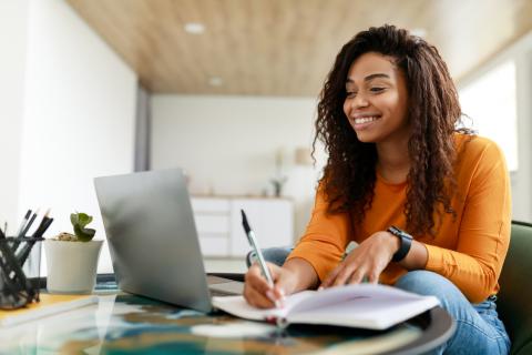 woman sitting on laptop