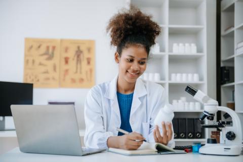 feamle student studying in a lab