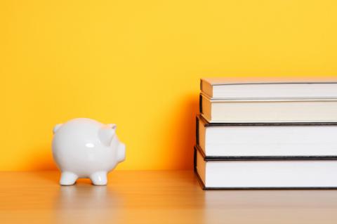 Piggy bank and books