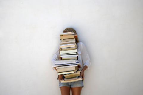 Student with pile of books